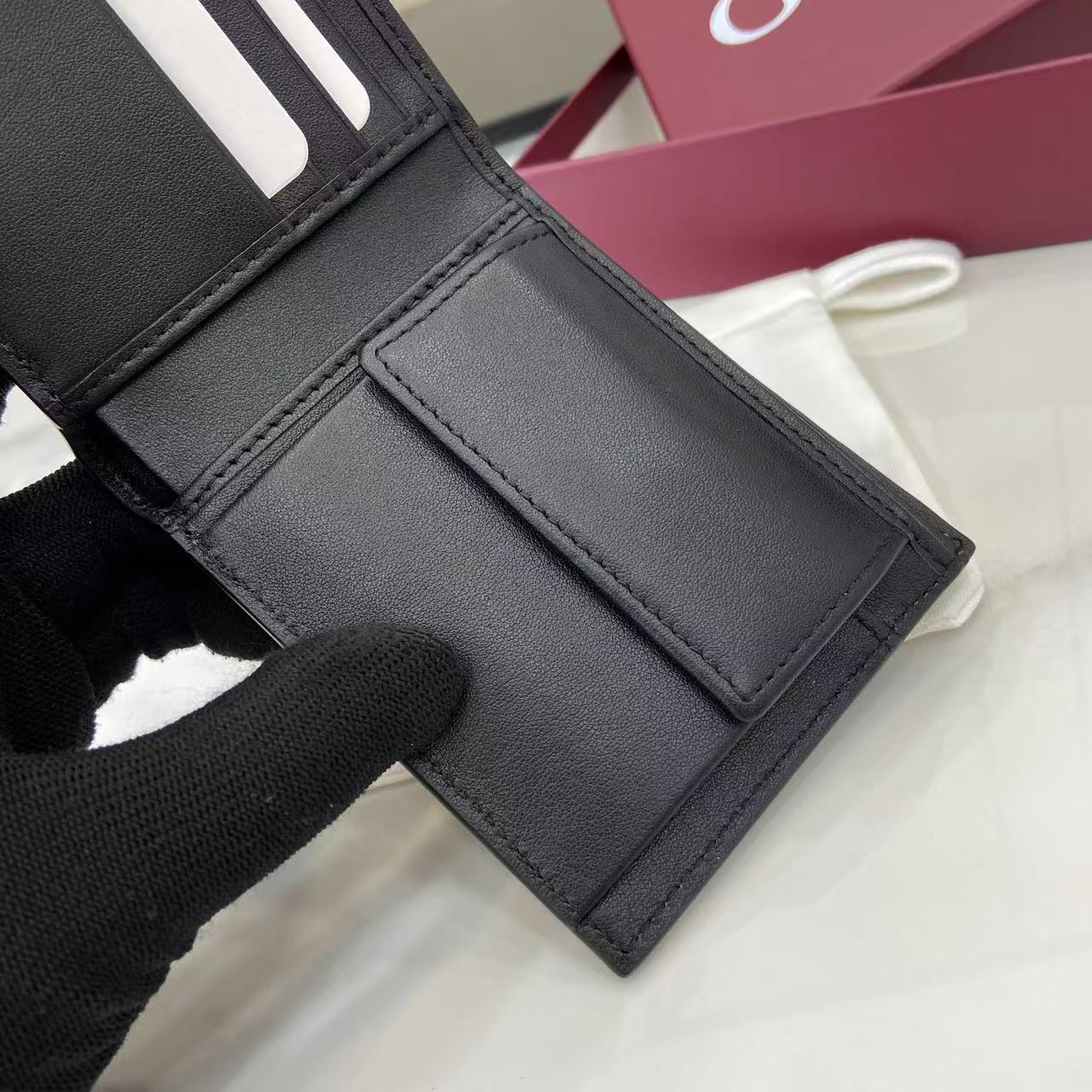 GG Emblem Black Embossed Bi-Fold Wallet auto draft